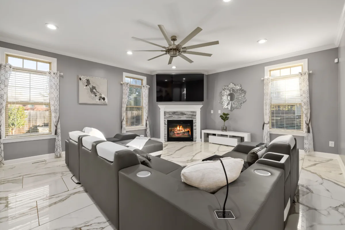 Staged living room with a fireplace and marble floor, the kind of space presented in a Matterport tour